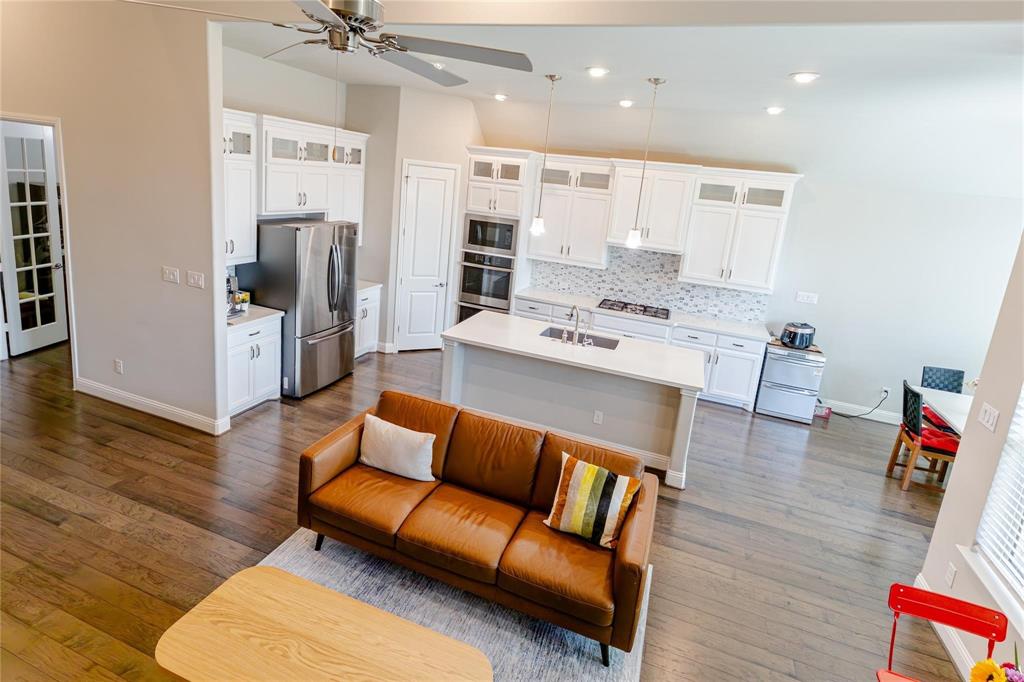 3920 Bentgrass Road Plano, TX 75023 - Photo 10 of 30 a living room with stainless steel appliances furniture and a view of kitchen