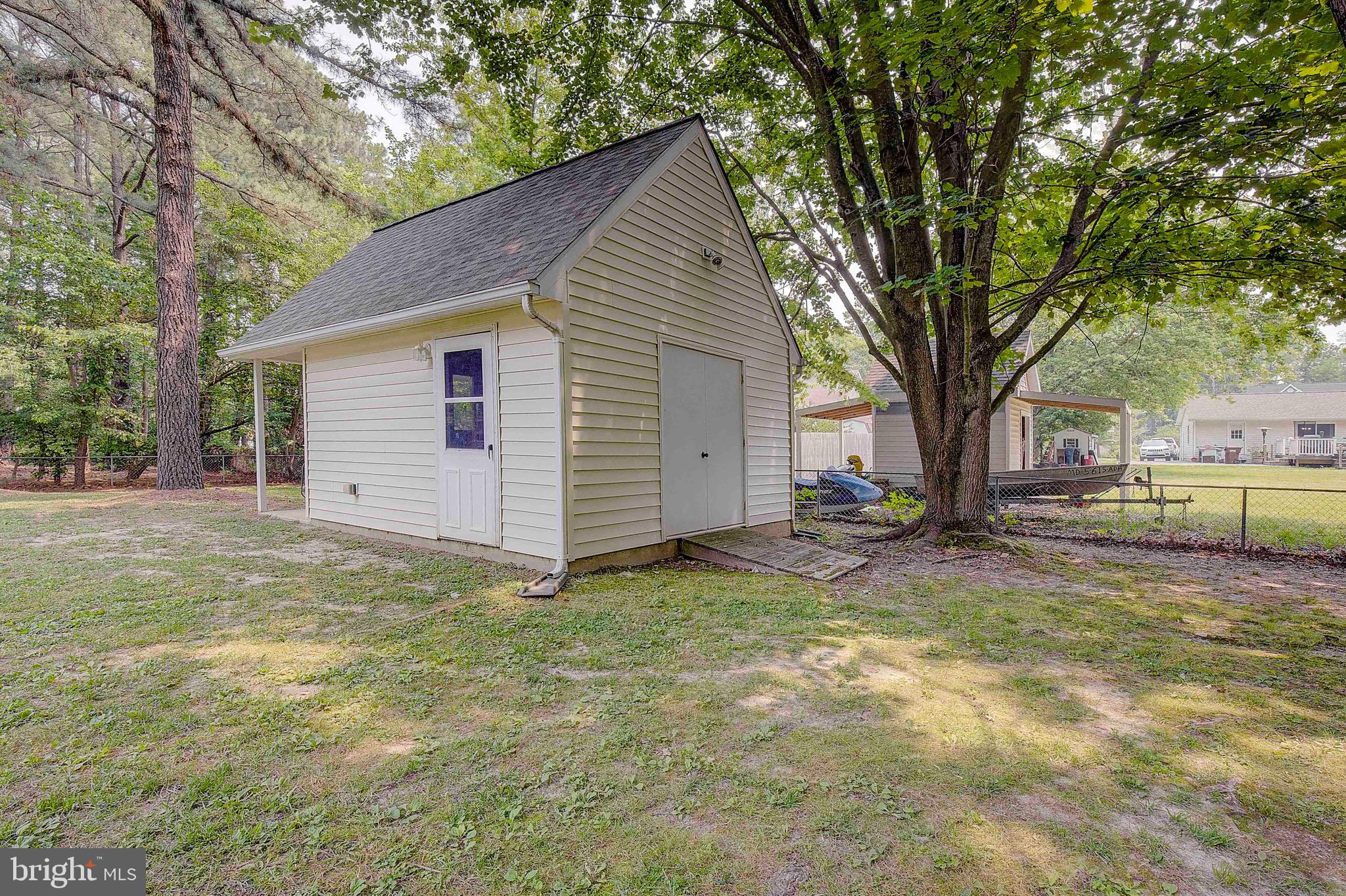 208 Dorchester Road Stevensville, MD 21666 - Photo 29 of 36 Shed has electric and window AC unit