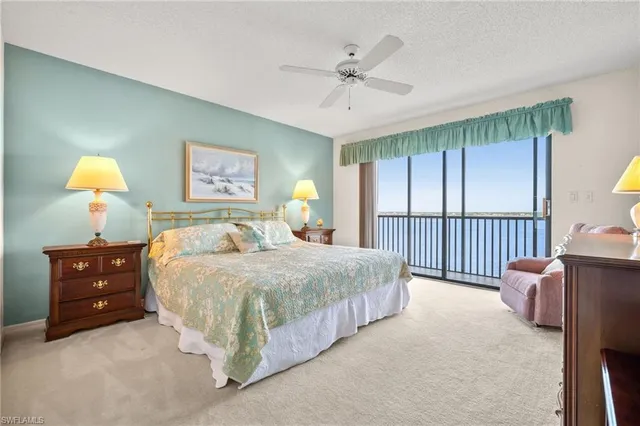 a bed room with a bed and a window