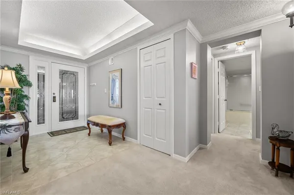 a bathroom with a tub mirror and toilet