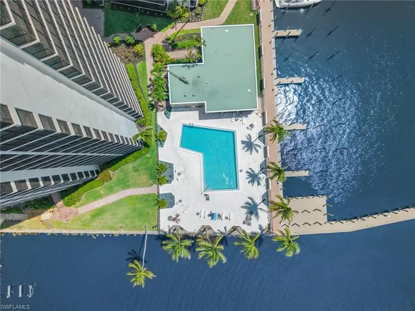 an aerial view of a house with a swimming pool
