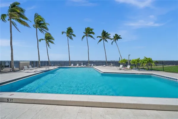 a view of a swimming pool and a chair