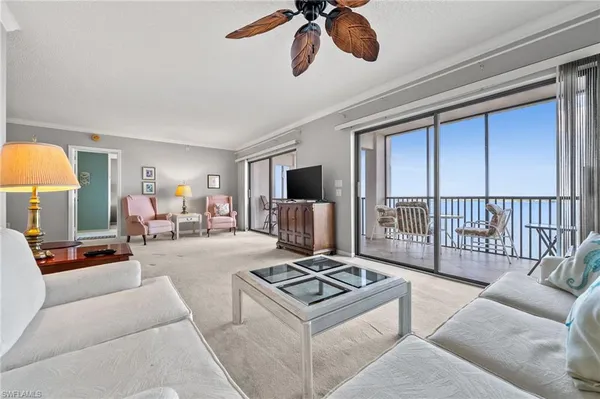 a living room with furniture tv and a fireplace