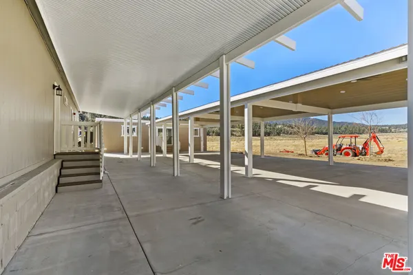 a view of a kitchen with a sink and a window
