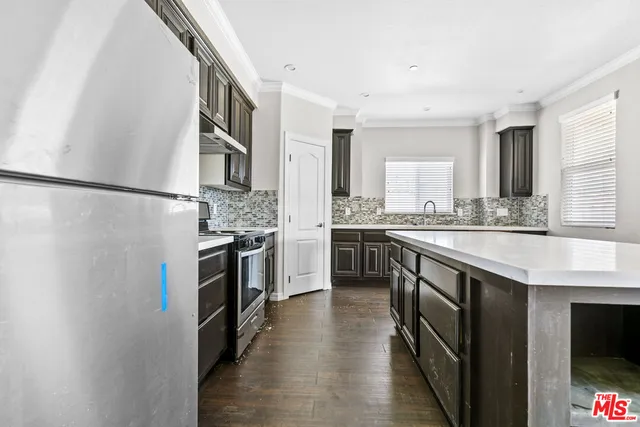 a bathroom with a sink a toilet and bathtub