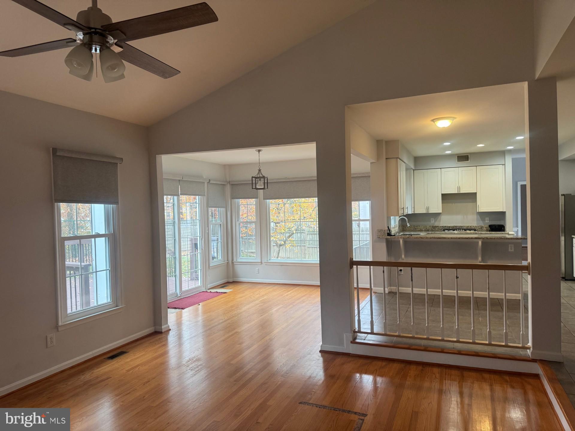 8143 Ridge Creek Way Springfield, VA 22153 - Photo 13 of 42 a view of an empty room with wooden floor and a window