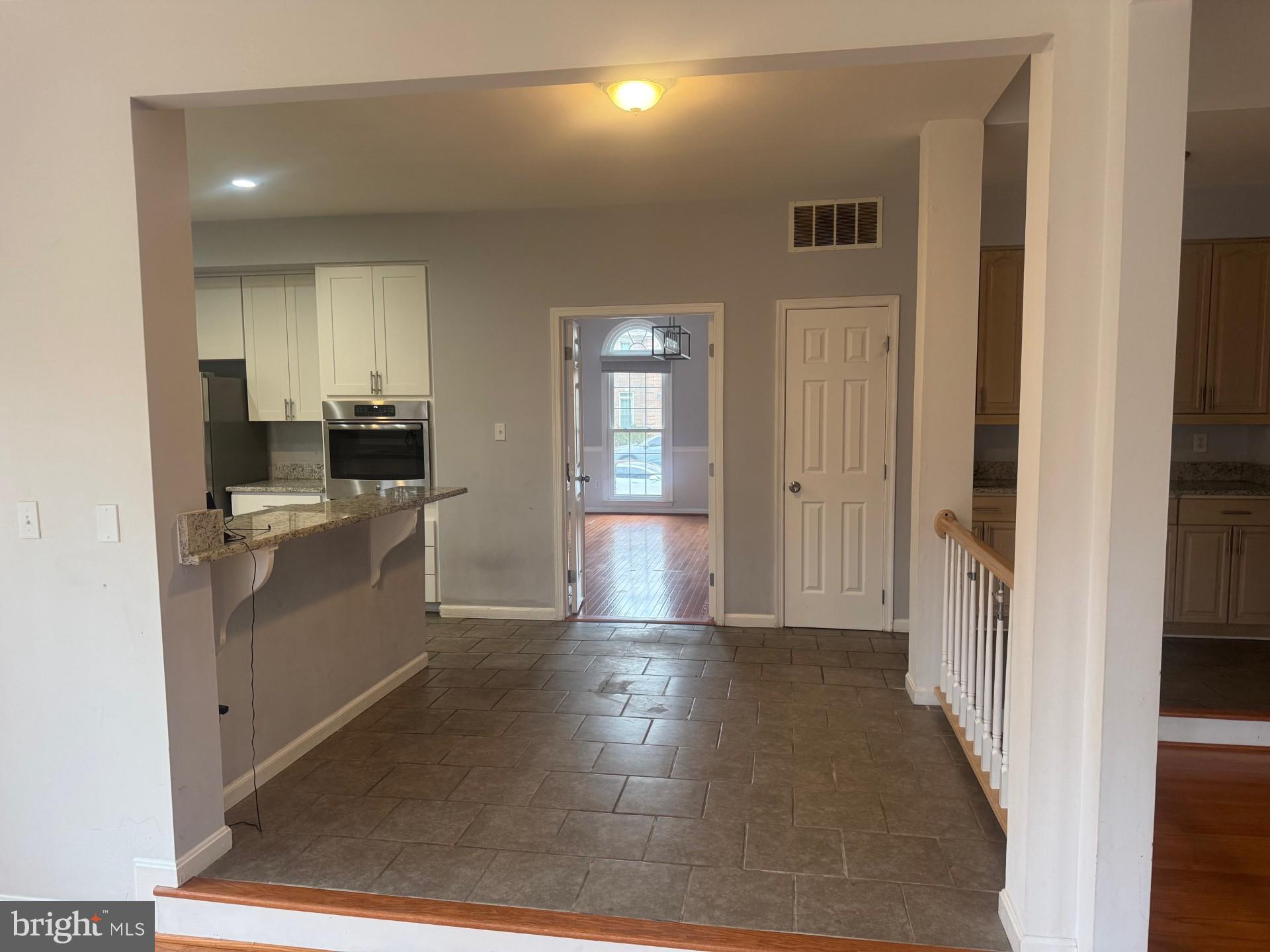 8143 Ridge Creek Way Springfield, VA 22153 - Photo 15 of 42 a view of a kitchen with a sink and dishwasher cabinets