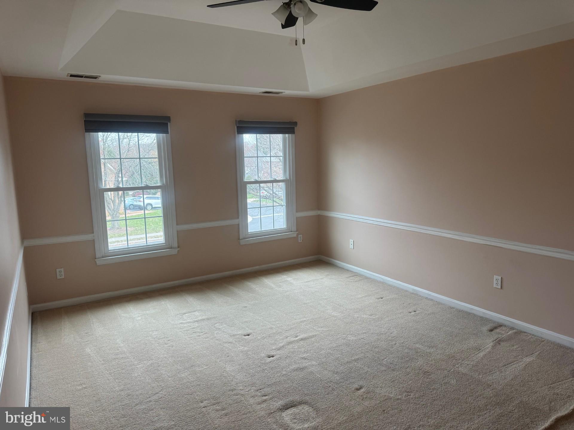 8143 Ridge Creek Way Springfield, VA 22153 - Photo 17 of 42 an empty room with windows and fan