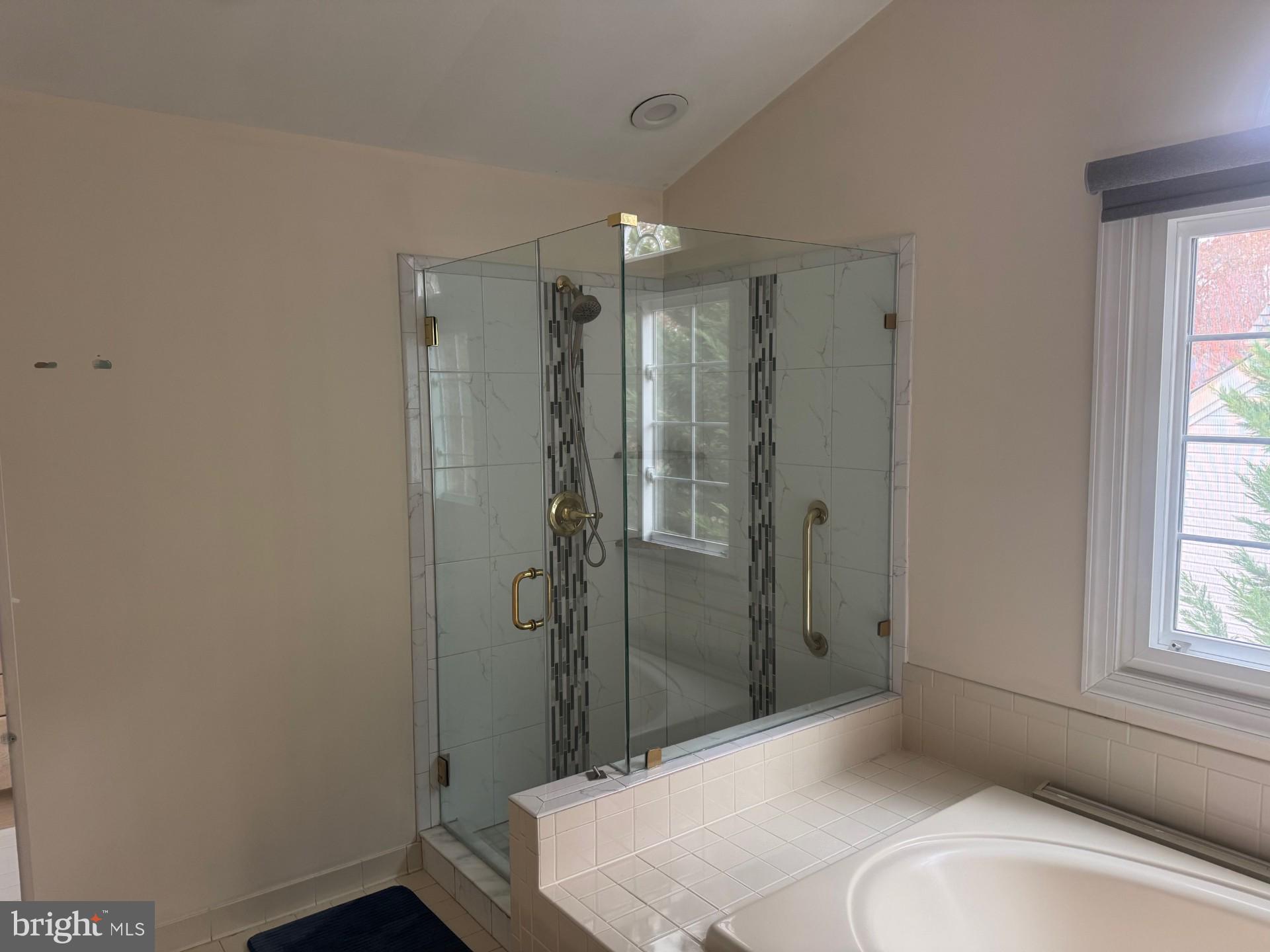 8143 Ridge Creek Way Springfield, VA 22153 - Photo 19 of 42 a bathroom with a sink and shower