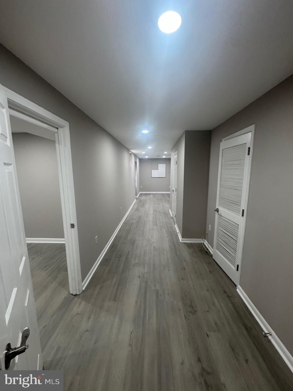 8143 Ridge Creek Way Springfield, VA 22153 - Photo 35 of 42 a view of hallway with wooden floor