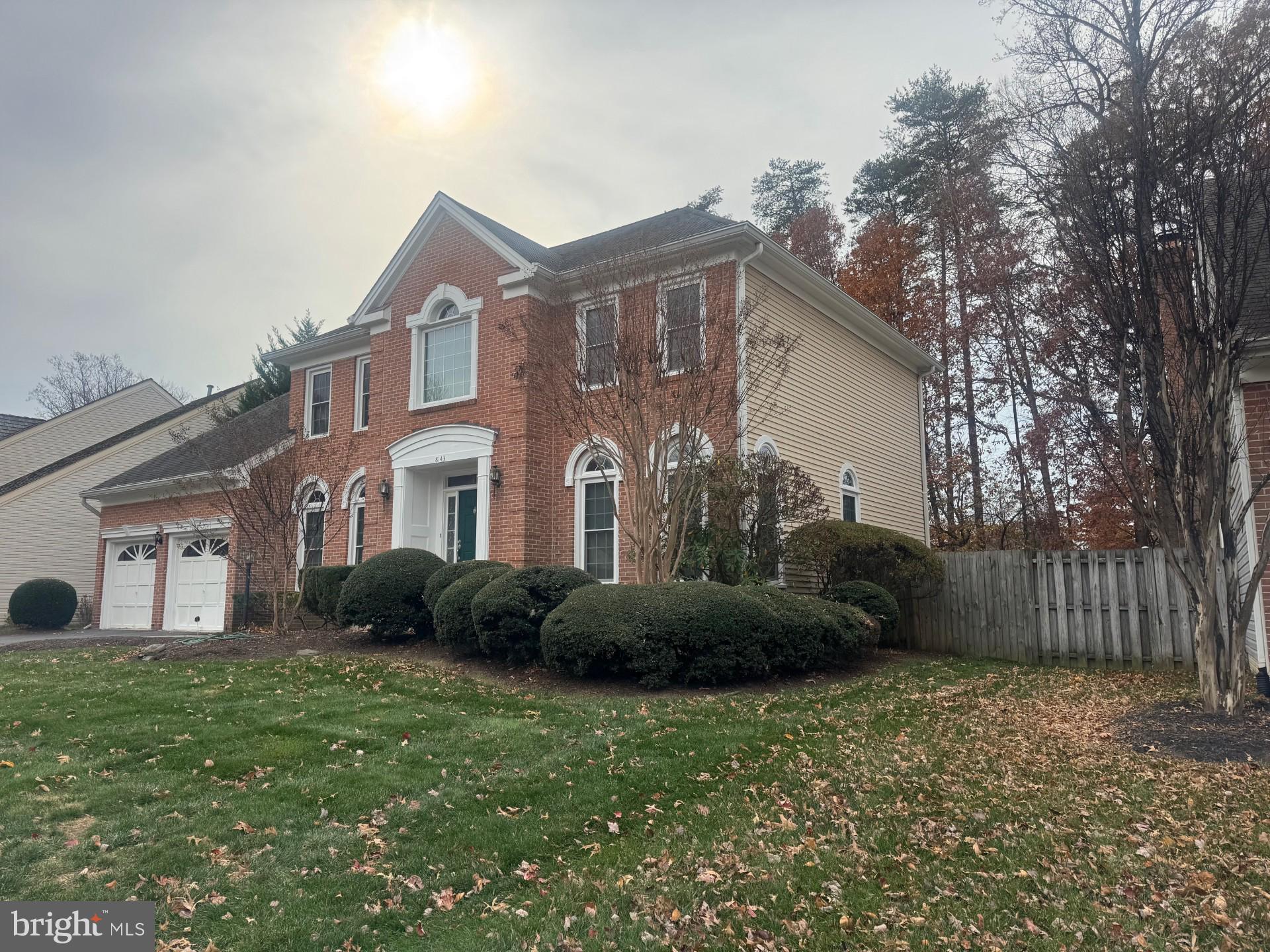 8143 Ridge Creek Way Springfield, VA 22153 - Photo 39 of 42 a front view of a house with garden