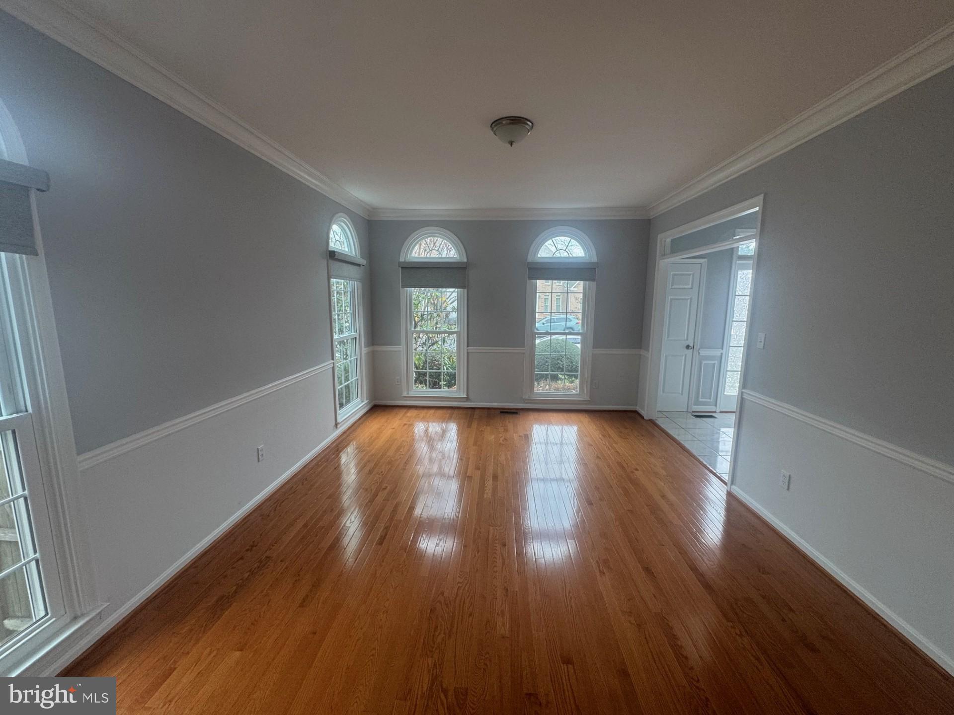 8143 Ridge Creek Way Springfield, VA 22153 - Photo 5 of 42 wooden floor in an empty room with a window