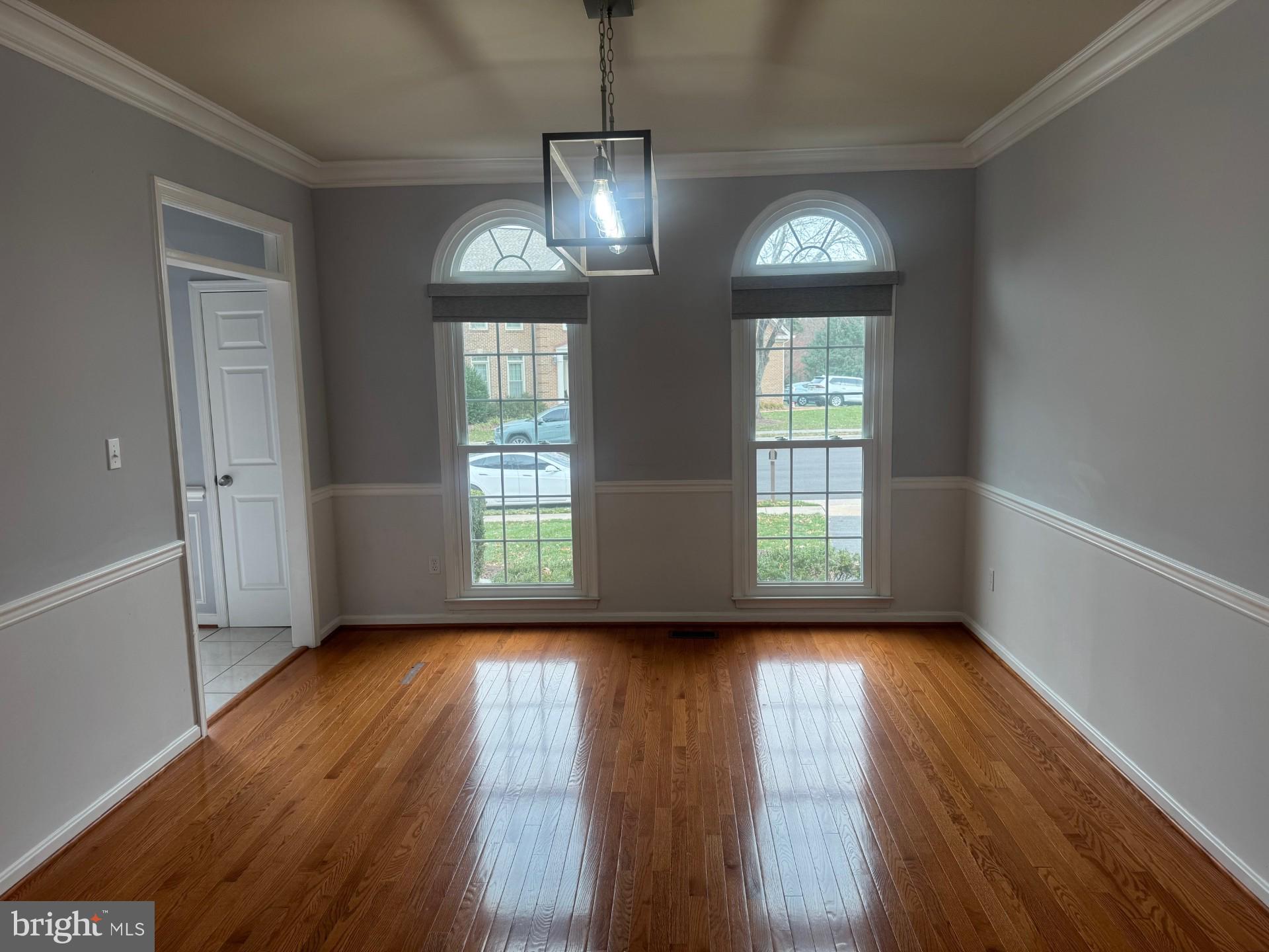8143 Ridge Creek Way Springfield, VA 22153 - Photo 6 of 42 a view of an empty room with wooden floor and a window