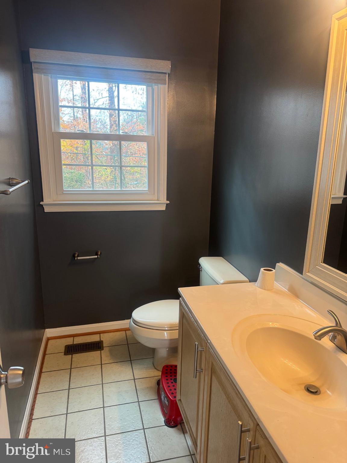 8143 Ridge Creek Way Springfield, VA 22153 - Photo 7 of 42 a bathroom with a sink a toilet and a vanity