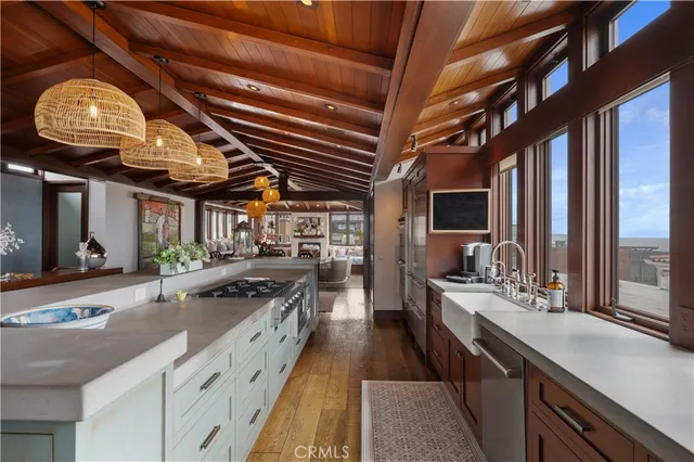 a view of a room with furniture and chandelier