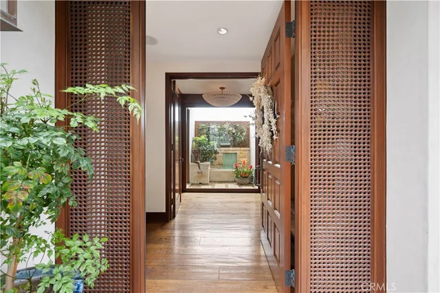 a room with a mirror and a wooden floor