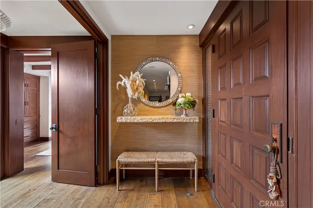 a living room with furniture a fireplace and a large window