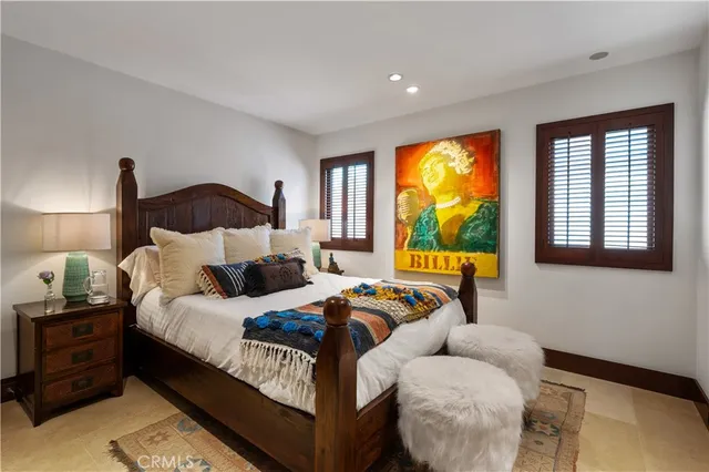 a view of a hallway with workspace and a window