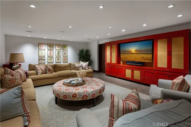 a bathroom with a tub sink vanity and mirror