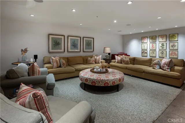 a bathroom with a granite countertop toilet sink and mirror