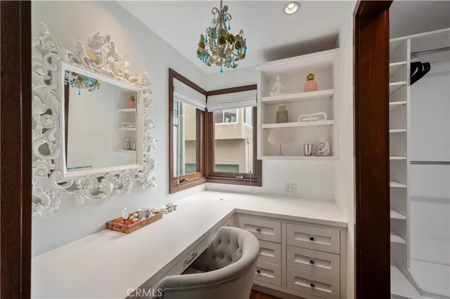 a view of table and chairs in wooden floor