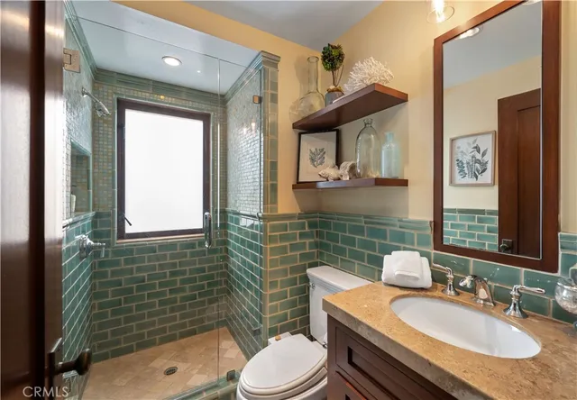 a view of a patio with couches chairs potted plants and a table