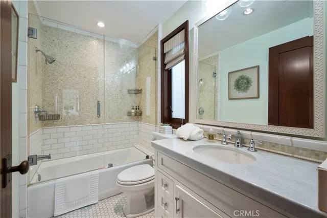 a view of a patio with couches table and chairs and potted plants