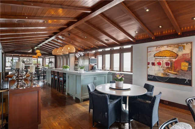 a living room with fireplace furniture and a large window