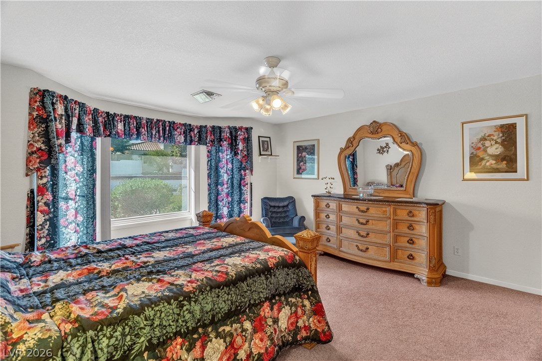2055 Cholla Way Laughlin, NV 89029 - Photo 23 of 87 A spacious bedroom featuring a broad window, providing ample natural illumination.