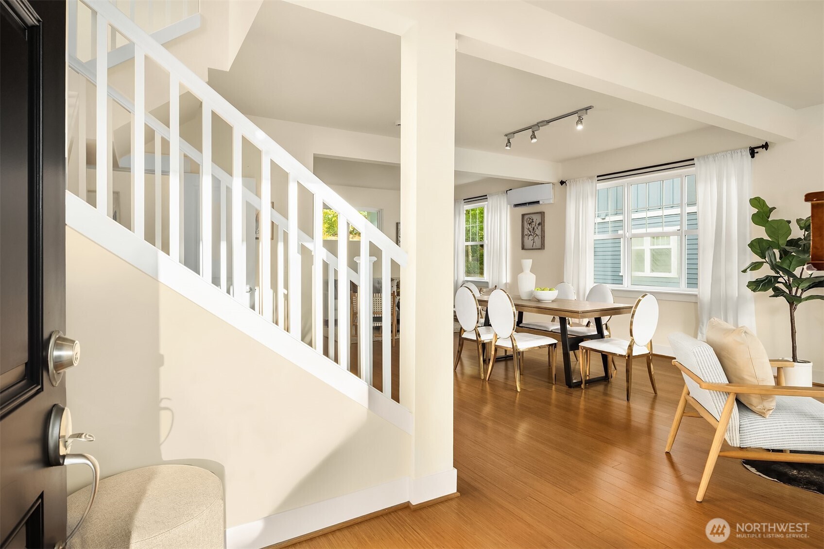 1748 25th Walk Northeast Issaquah, WA 98029 - Photo 2 of 40 a view of dining room with furniture window and wooden floor