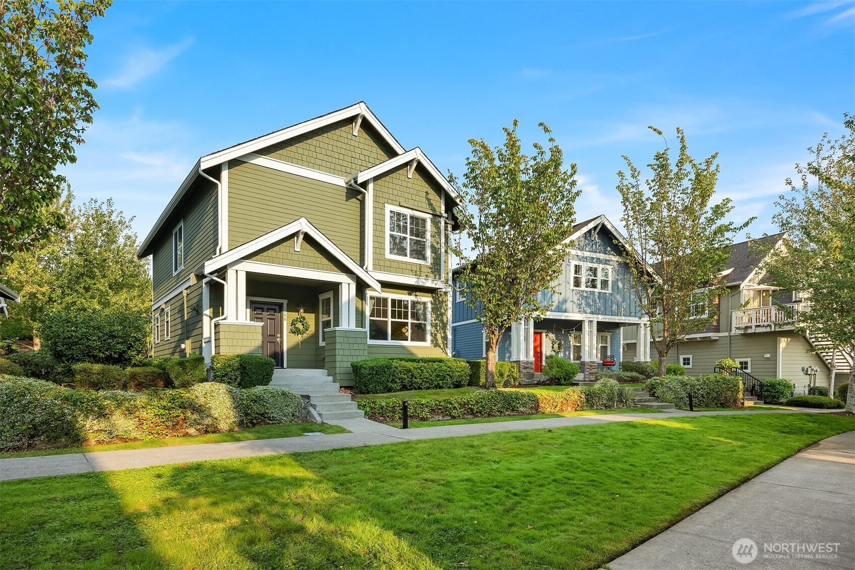 1748 25th Walk Northeast Issaquah, WA 98029 - Photo 32 of 40 a front view of a house with a yard and trees
