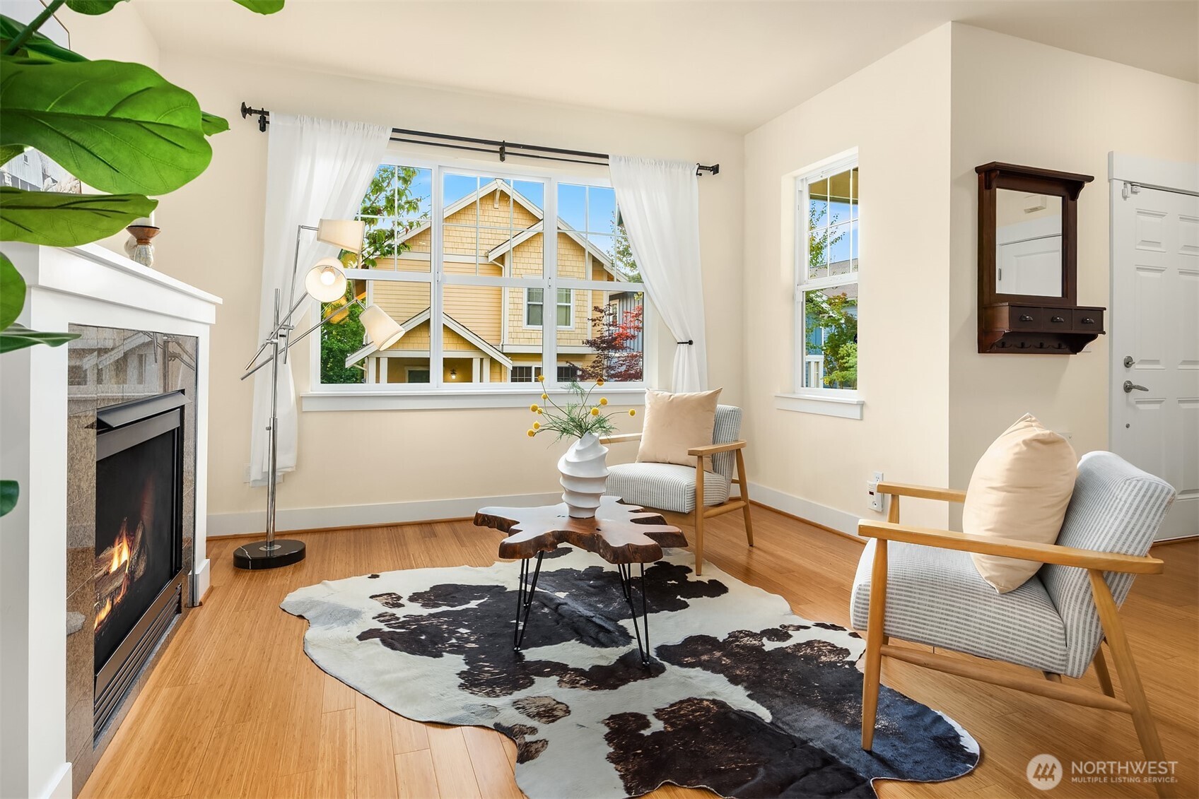 1748 25th Walk Northeast Issaquah, WA 98029 - Photo 5 of 40 a living room with furniture a fireplace and a flat screen tv