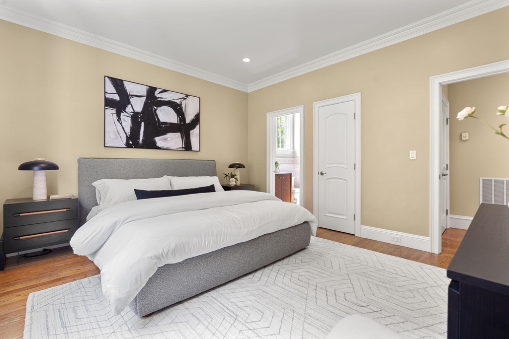 22 Scotney Road Newton, MA 02467 - Photo 20 of 42 a bedroom with a bed and a painting on the wall