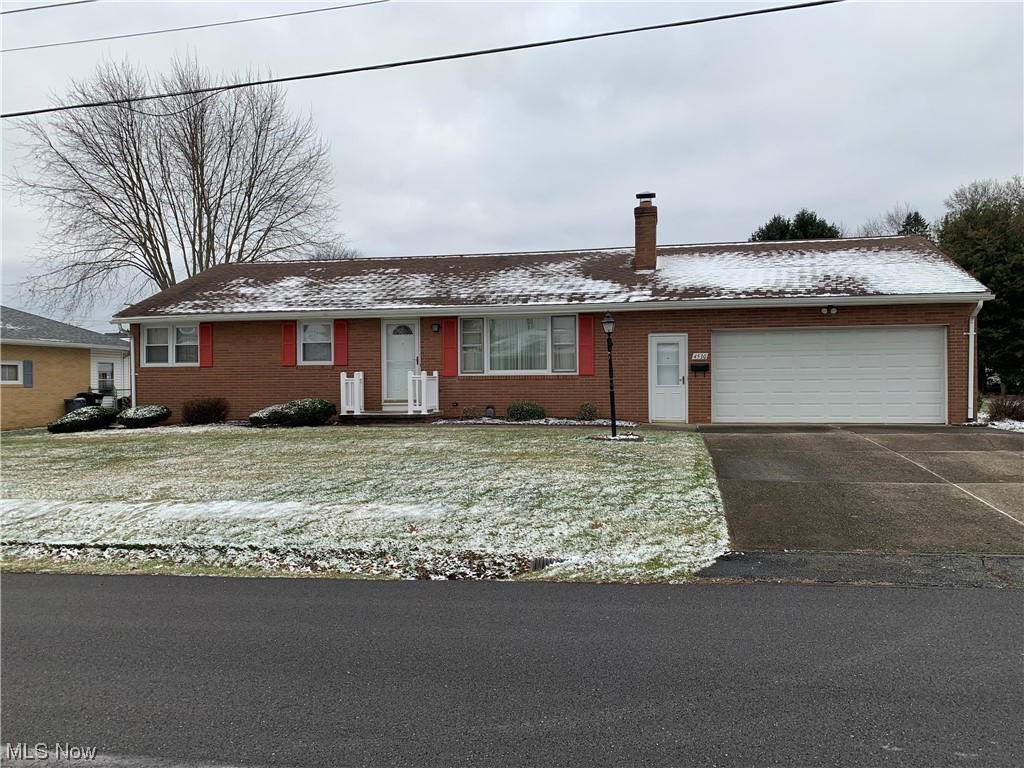 4530 8th Street Northwest Canton, OH 44708 - Photo 1 of 8 Ranch-style home featuring a garage and a front lawn