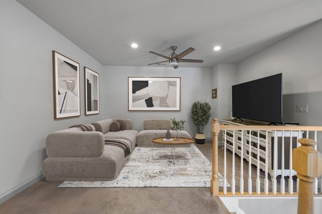 57 Phoebe Street, Unit 33 Methuen, MA 01844 - Photo 20 of 41 a living room with furniture and a flat screen tv