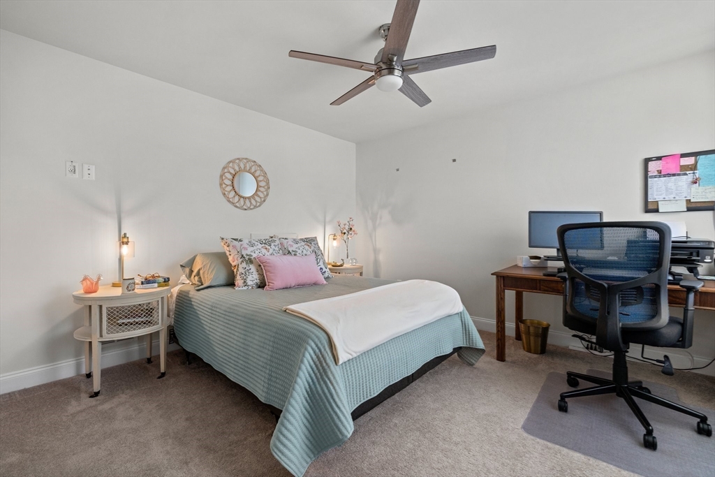 57 Phoebe Street, Unit 33 Methuen, MA 01844 - Photo 23 of 41 a bedroom with a bed desk and a chair