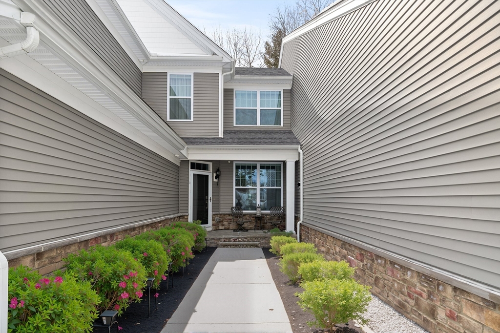 57 Phoebe Street, Unit 33 Methuen, MA 01844 - Photo 27 of 41 a front view of a house with a porch