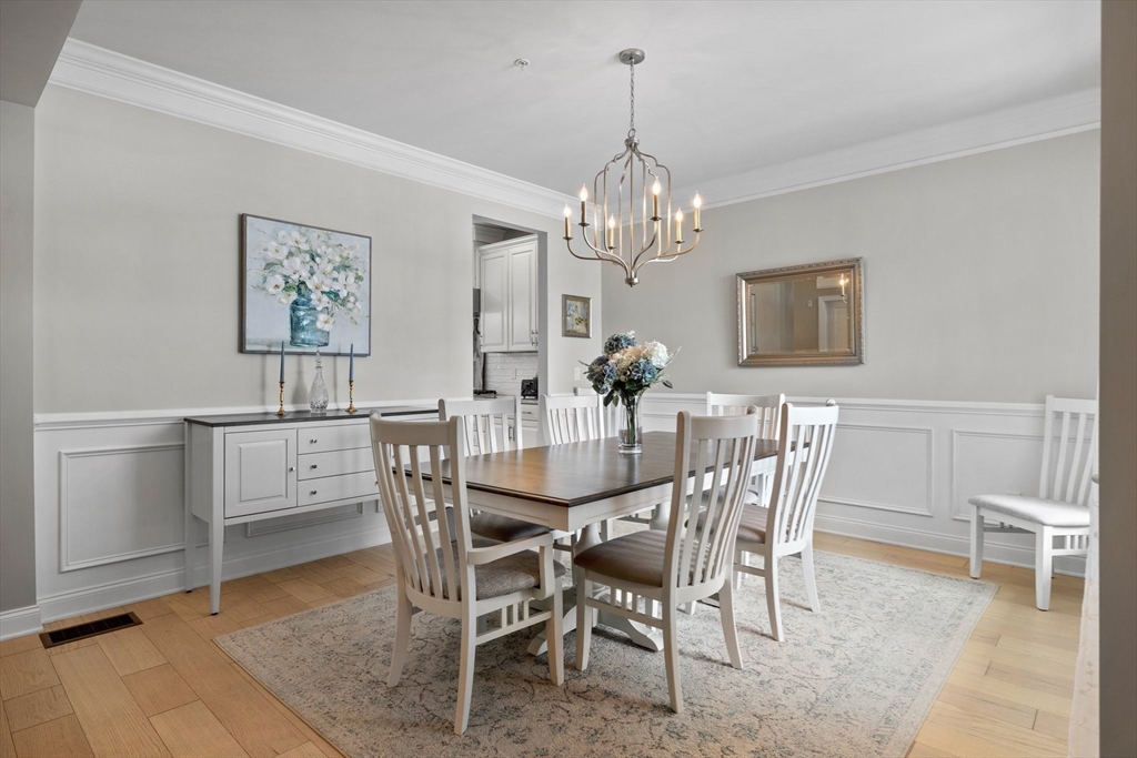 57 Phoebe Street, Unit 33 Methuen, MA 01844 - Photo 5 of 41 a view of a dining room with furniture and chandelier