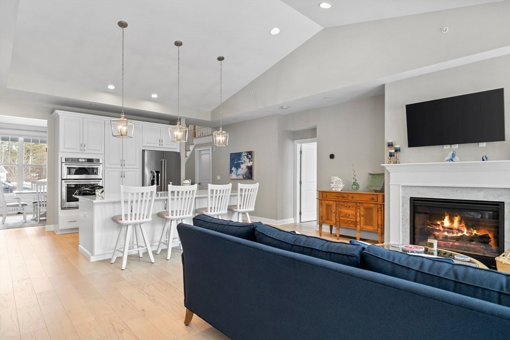 57 Phoebe Street, Unit 33 Methuen, MA 01844 - Photo 6 of 41 a living room with stainless steel appliances furniture a fireplace a flat screen tv and view