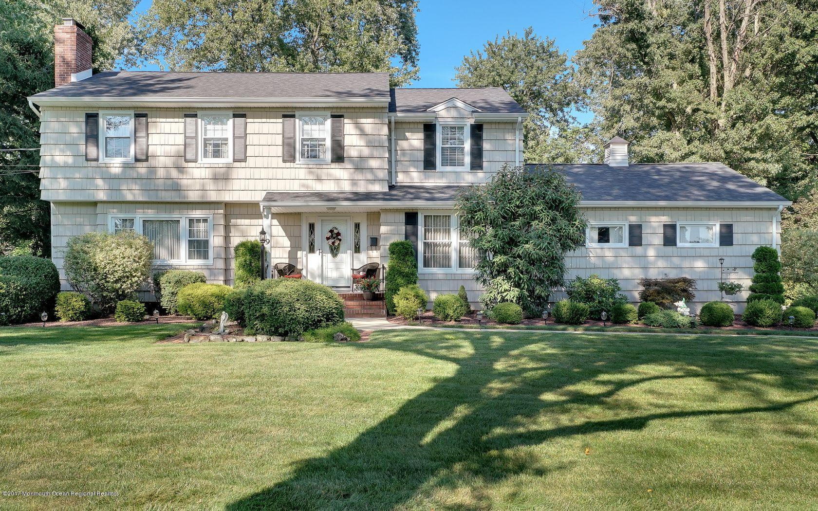 9 Cornwall Road Freehold, NJ 07728 - Photo 1 of 38 a front view of a house with a yard
