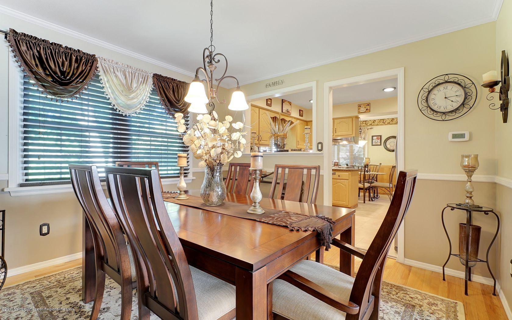 9 Cornwall Road Freehold, NJ 07728 - Photo 11 of 38 a view of a dining room with furniture and a chandelier