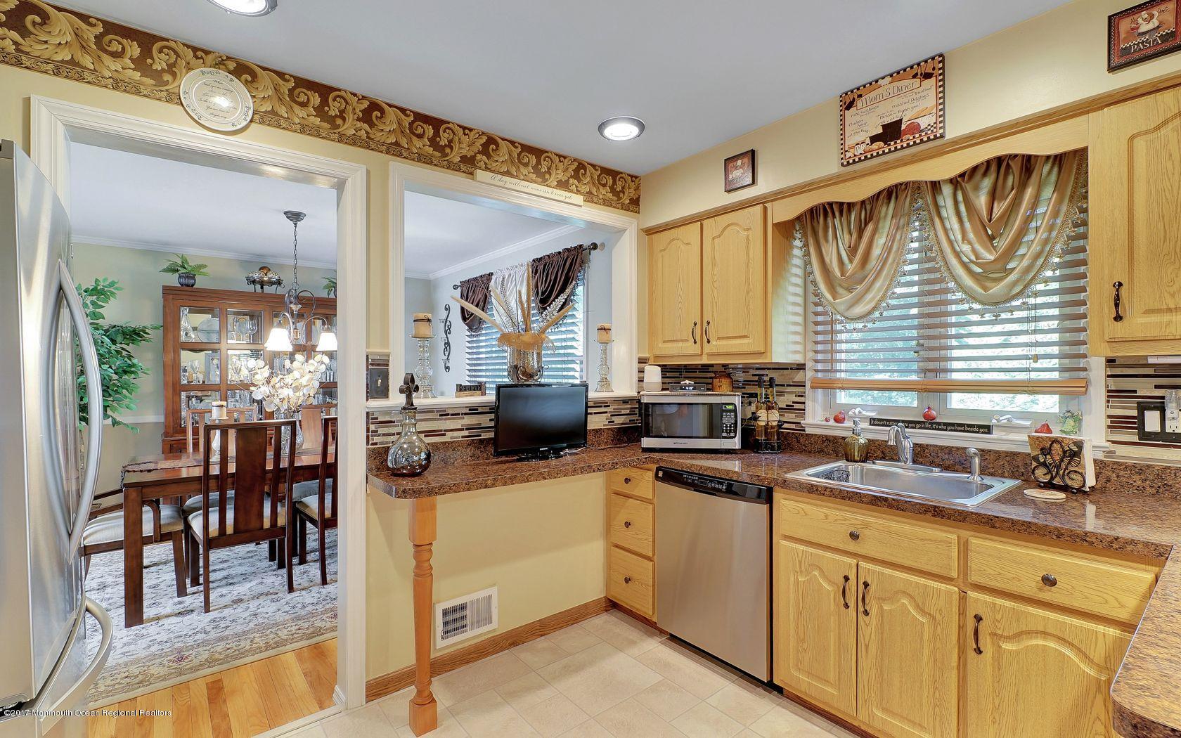 9 Cornwall Road Freehold, NJ 07728 - Photo 16 of 38 a kitchen with a sink cabinets and window