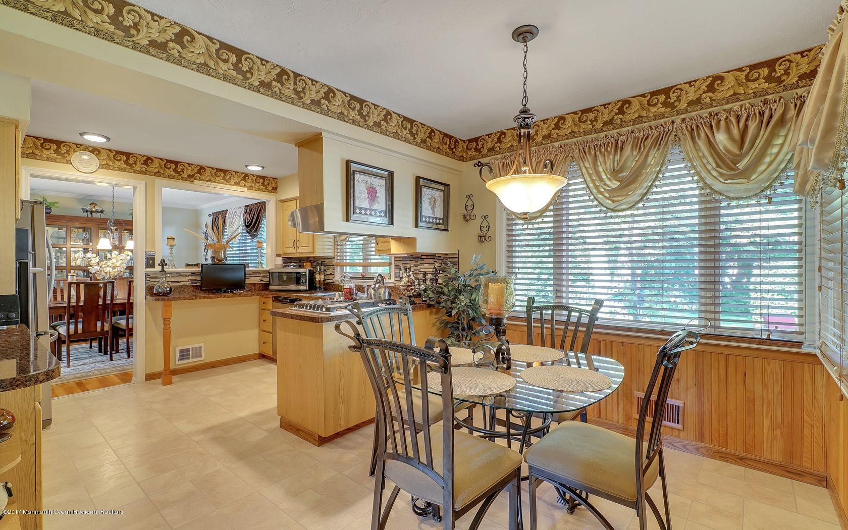 9 Cornwall Road Freehold, NJ 07728 - Photo 17 of 38 a dining room with a table and chairs