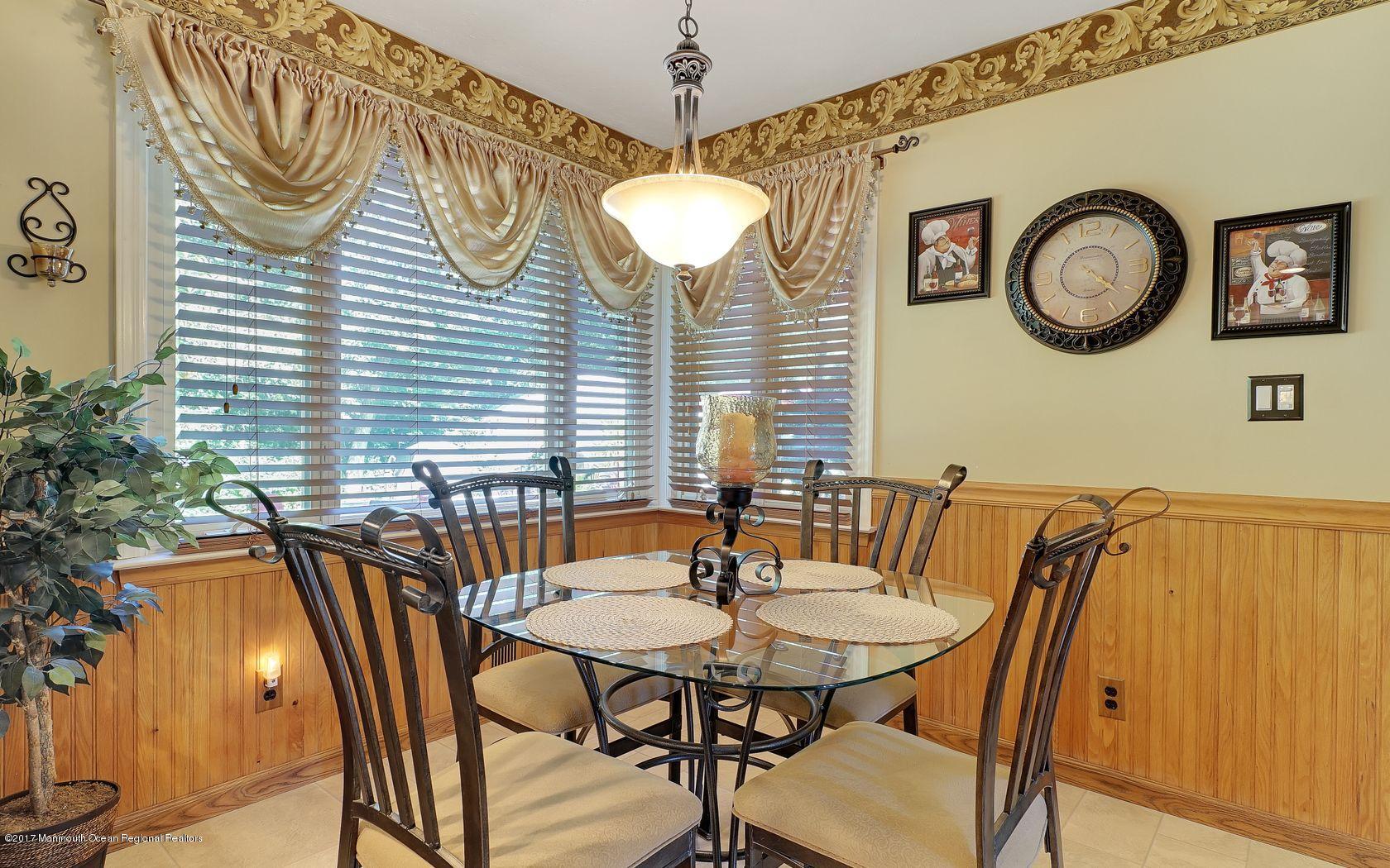 9 Cornwall Road Freehold, NJ 07728 - Photo 18 of 38 a table and chairs in a patio