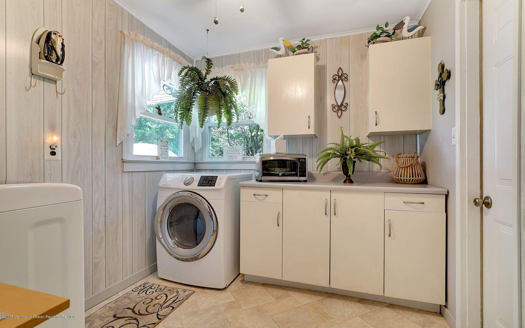 9 Cornwall Road Freehold, NJ 07728 - Photo 20 of 38 a close view of a utility room with washer and dryer