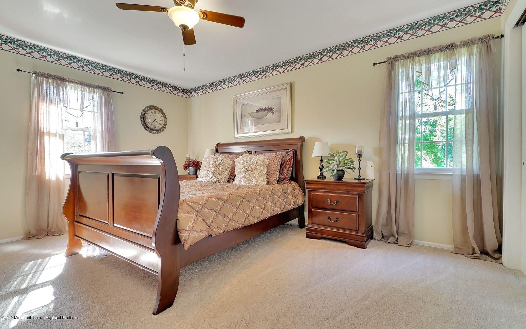 9 Cornwall Road Freehold, NJ 07728 - Photo 30 of 38 a bedroom with a bed and a window
