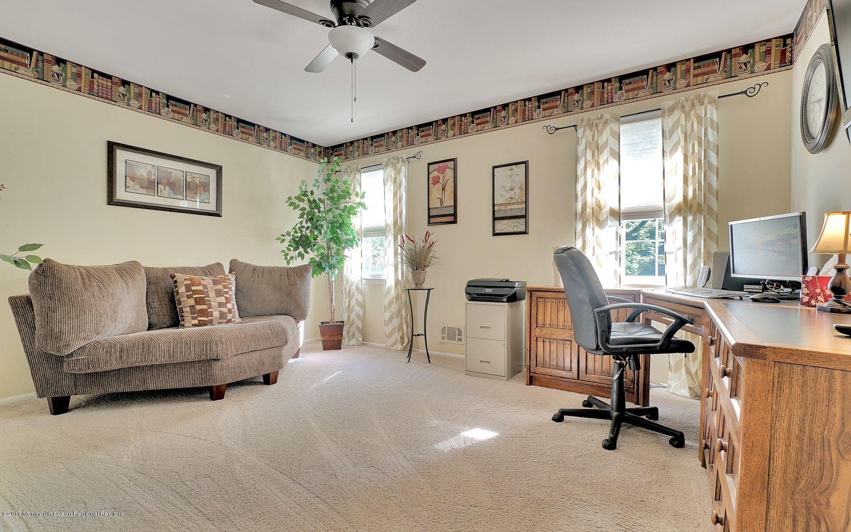 9 Cornwall Road Freehold, NJ 07728 - Photo 31 of 38 a view of a livingroom with workspace and a window