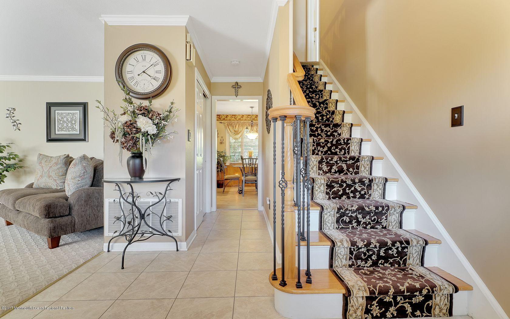 9 Cornwall Road Freehold, NJ 07728 - Photo 6 of 38 a view of entryway with wooden floor