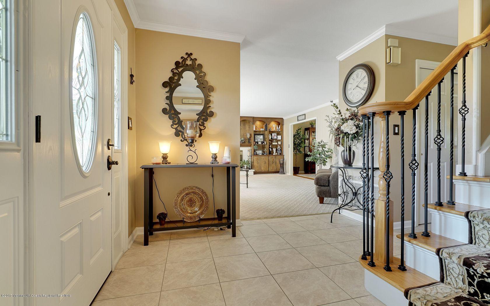 9 Cornwall Road Freehold, NJ 07728 - Photo 7 of 38 a view of living room kitchen and entryway