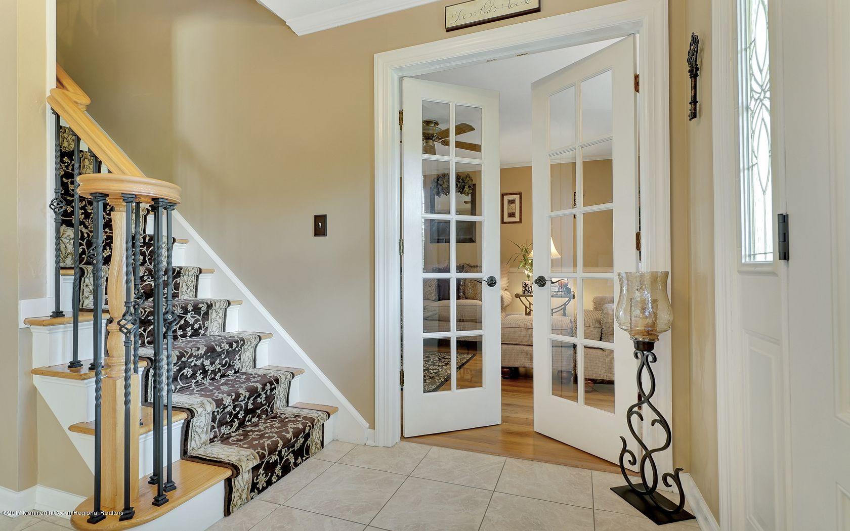 9 Cornwall Road Freehold, NJ 07728 - Photo 8 of 38 a view of an entryway with staircase